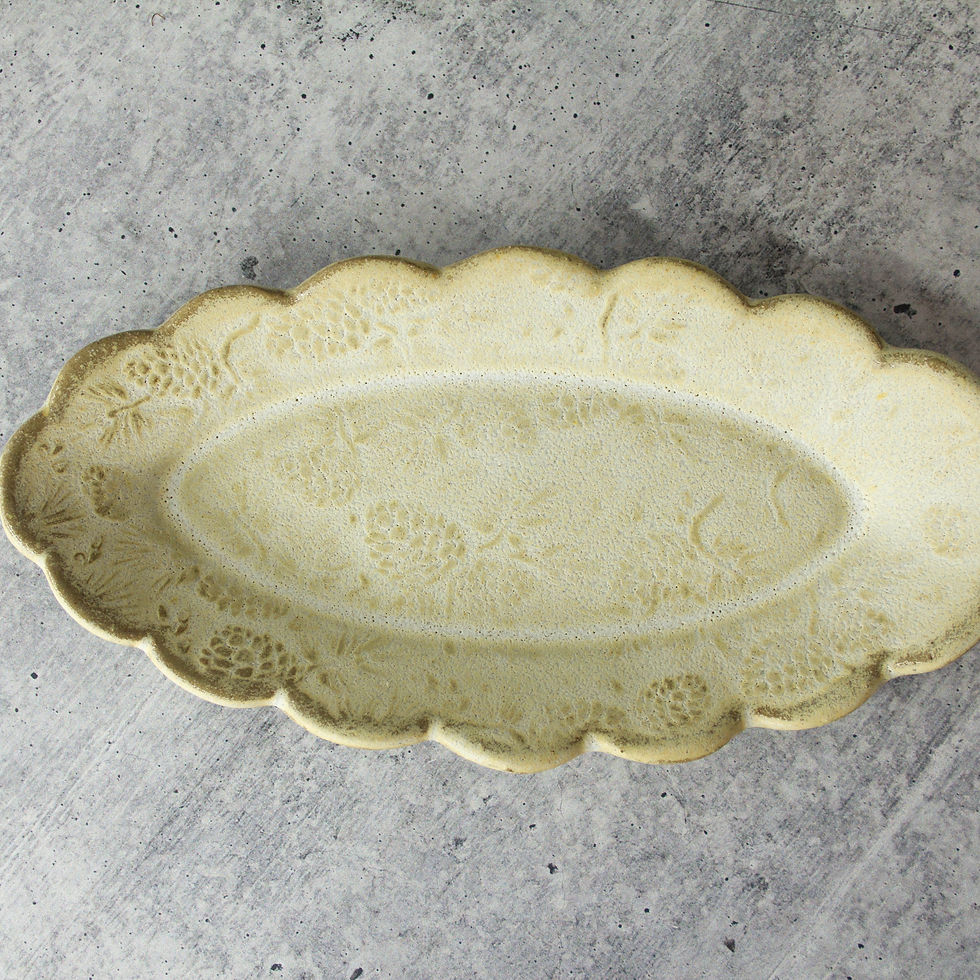 Handmade ceramic butter dish with pine cone texture and scalloped edges In stoneware clay.