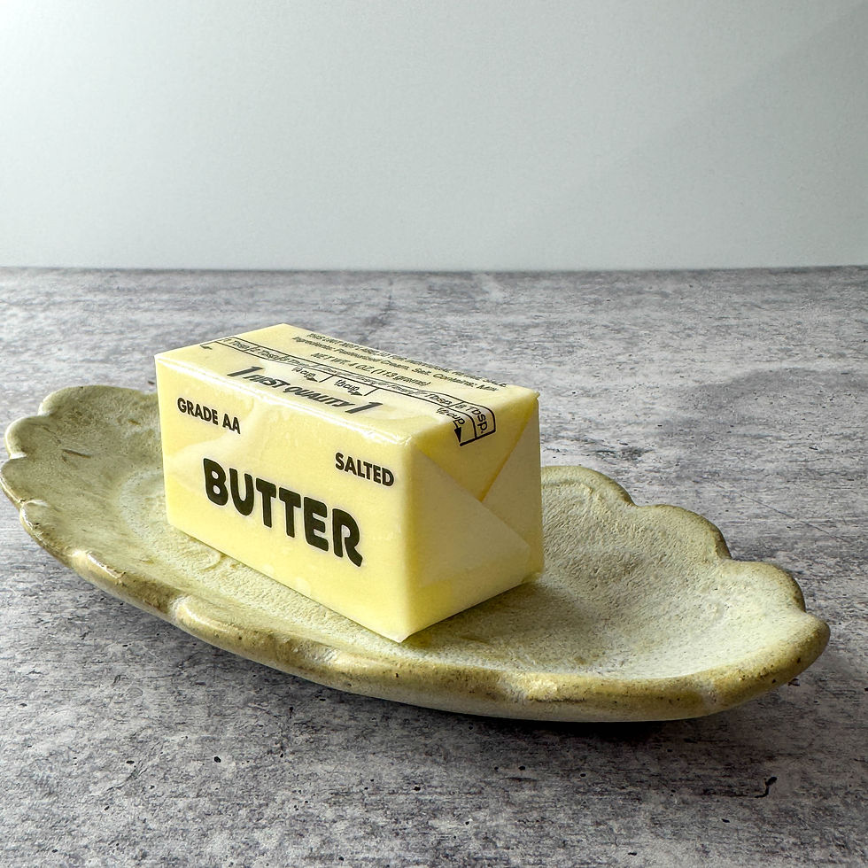 Handmade ceramic butter dish with pine cone texture and scalloped edges In stoneware clay.