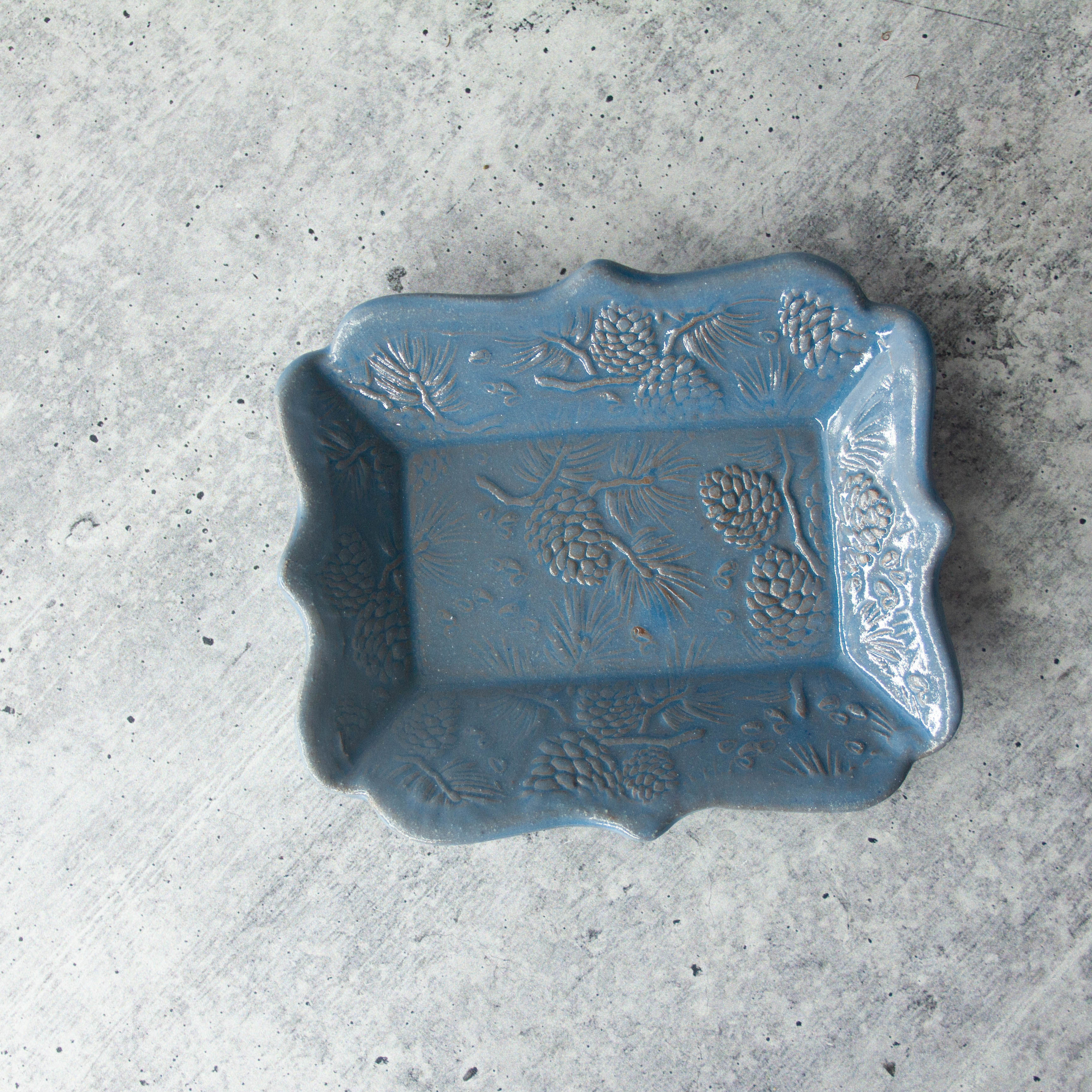 Functional ceramic dish with nature-inspired texture, ideal for serving or display