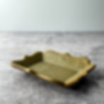 Handcrafted stoneware dish with scalloped edges and intricate pinecone-inspired texture, made in Idyllwild, California