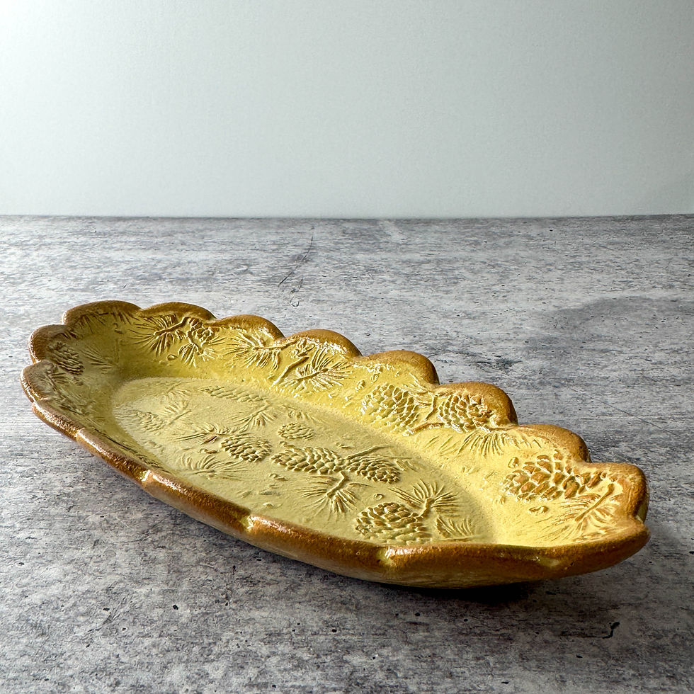 Handmade ceramic butter dish with pine cone texture and scalloped edges In stoneware clay.