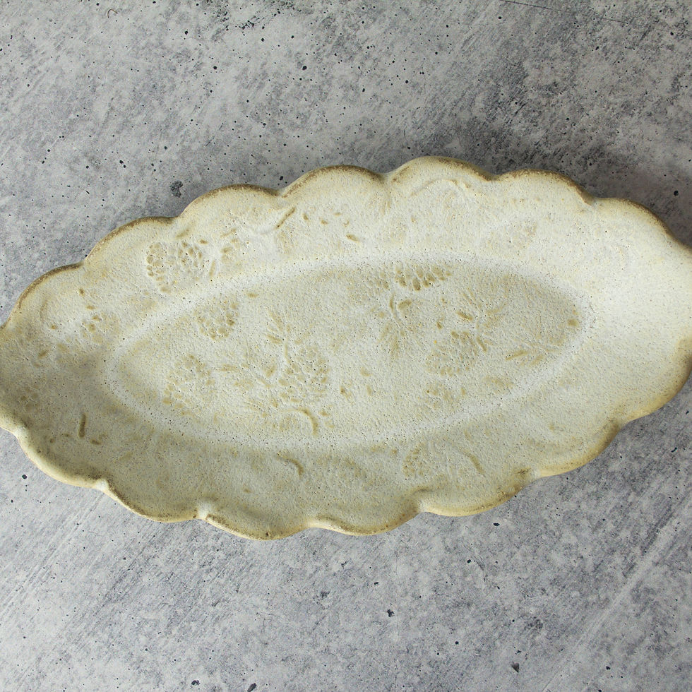 Handmade ceramic butter dish with pine cone texture and scalloped edges In stoneware clay.