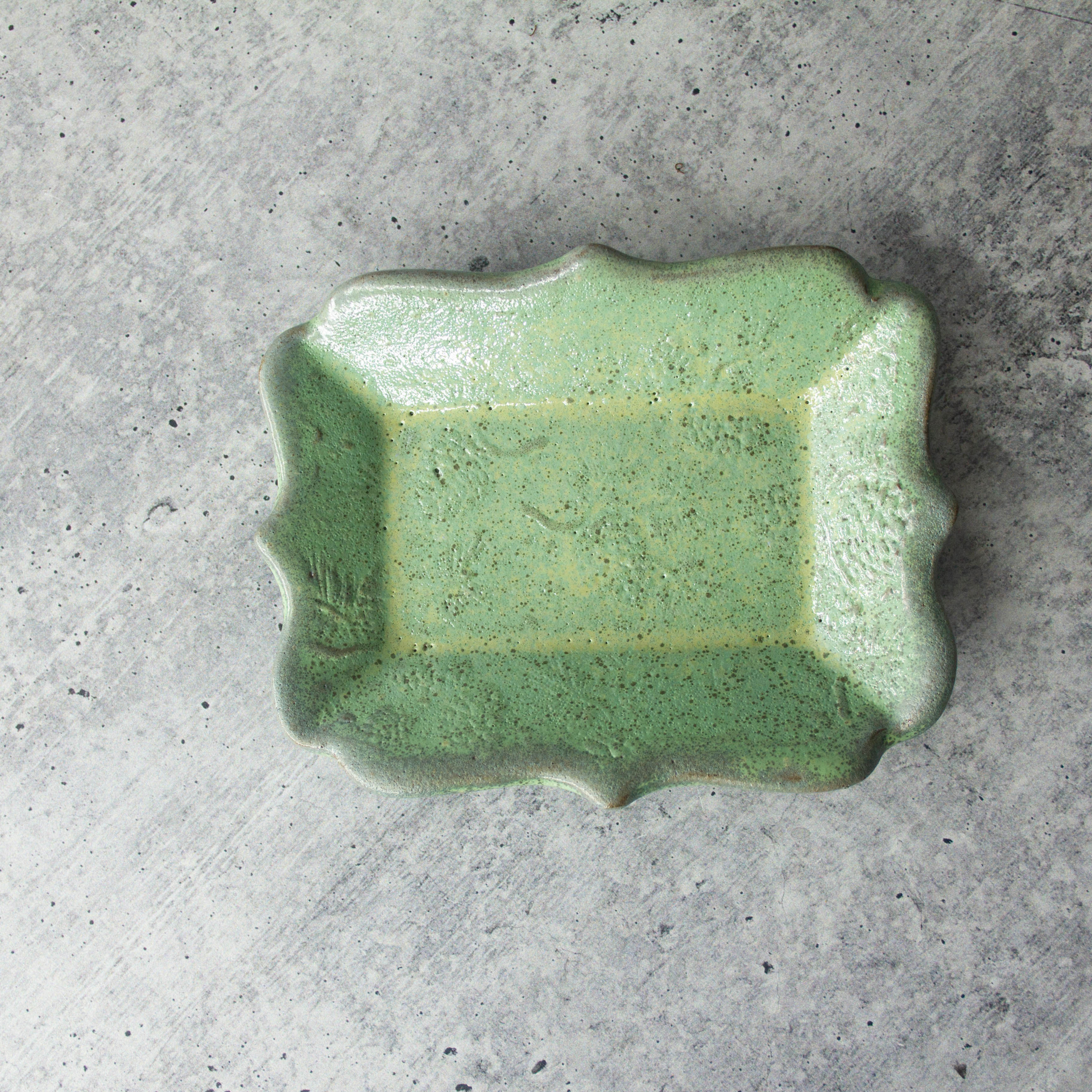 Textured handmade ceramic tray showing detailed relief pattern and smooth glazed surface and multi-purpose design