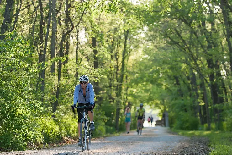 Woman biking on bike trail