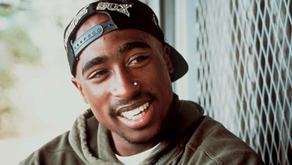 How do Tupac Shakur and Wilfred Owen Create a Sense of Identity or Emotion in Poetry?
