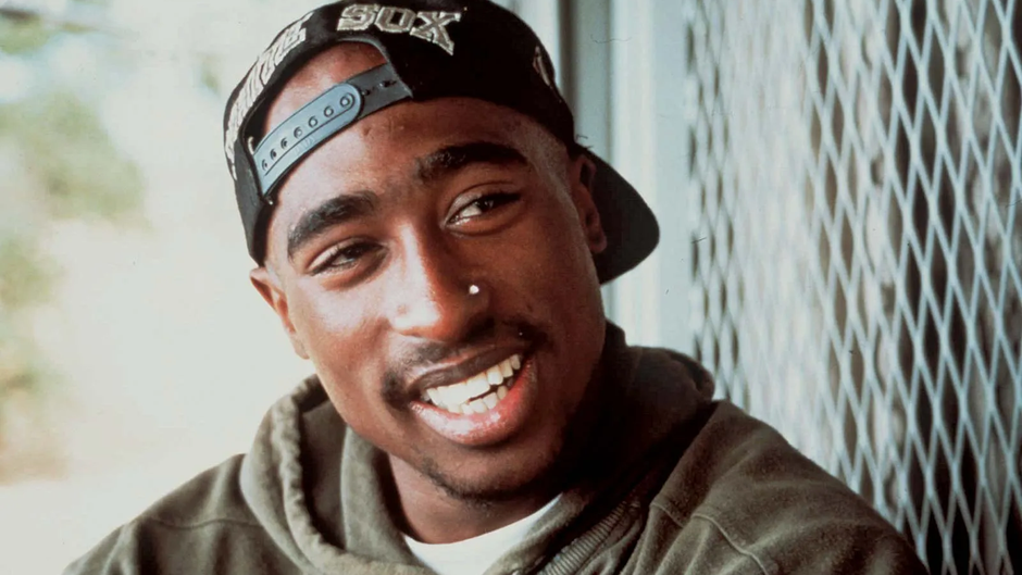 How do Tupac Shakur and Wilfred Owen Create a Sense of Identity or Emotion in Poetry?