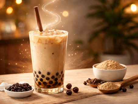 A glass of boba milk tea with a thick brown straw, featuring dark pearls at the bottom and steam-like swirls, next to a bowl of brown sugar.