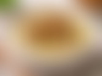 A warm bowl of creamy potato soup recipe topped with crispy cubes of Jans Royal Tempeh and fresh herbs.