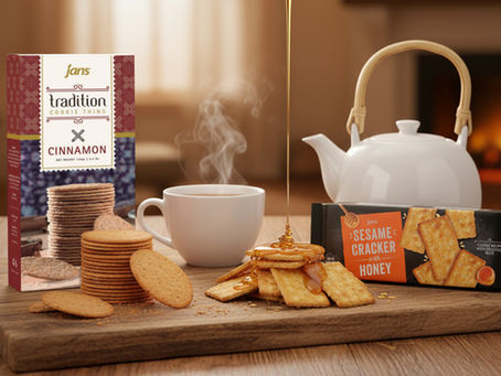 A visually appealing product display showing Jans Tradition Thins Cinnamon and Jans Sesame Cracker Honey being served with tea and honey.