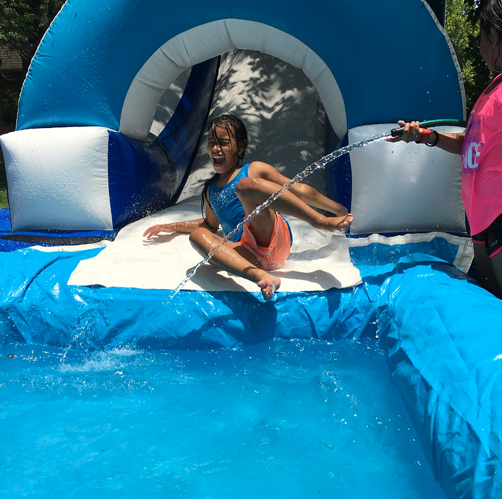 The water slide was an added surprise at the end of the week, paid for by one of the youth groups working the camp. 