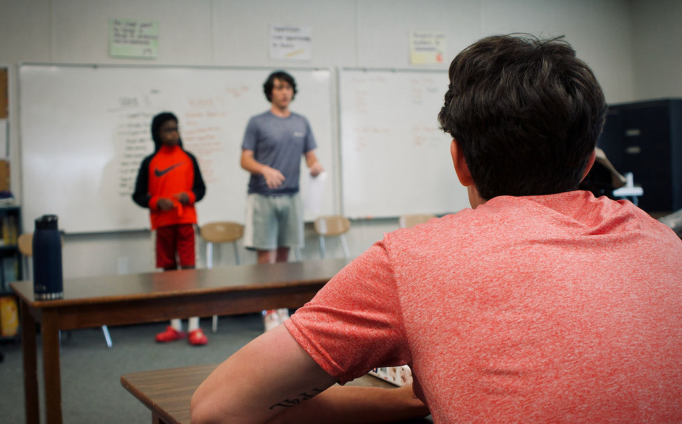 Youth practiced public speaking during a professional skills training. They learned how to effectively deliver their message and consider the audience.