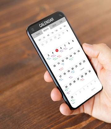 Man using calendar app on mobile phone_edited.jpg