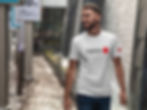 This image, found on the homepage of the GAFFAN website, is related to the headline 'Designed by fans, for fans' and shows a man wearing the Japan T-shirt GAFFAN Style I. GAFFAN is a soccer clothing brand that designs and sells mens and womens casual and soccer t-shirts with shipping available to all the USA and Canada.