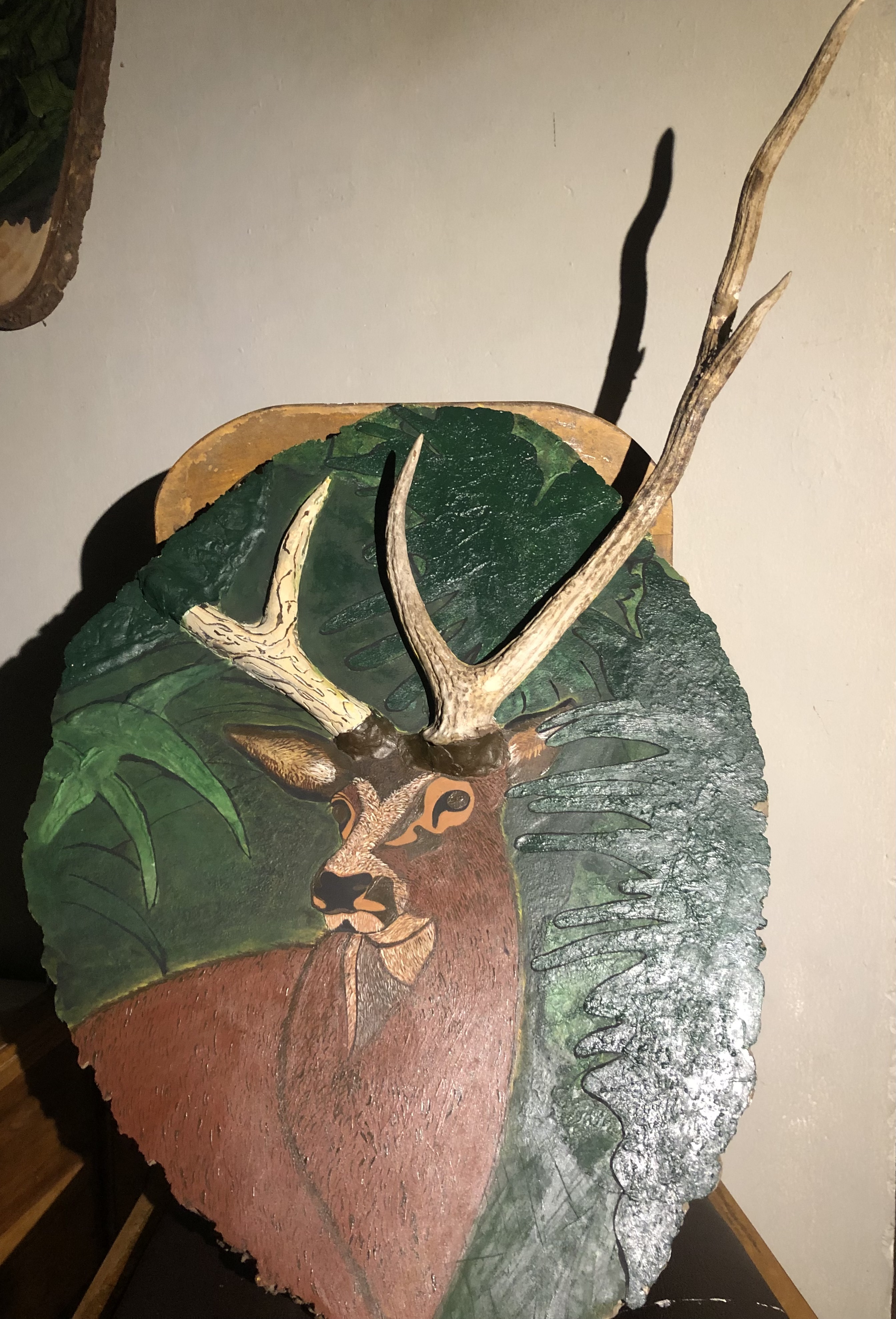 3D wood art by Kaveesha Dissanayaka, hand-painted deer centerpiece