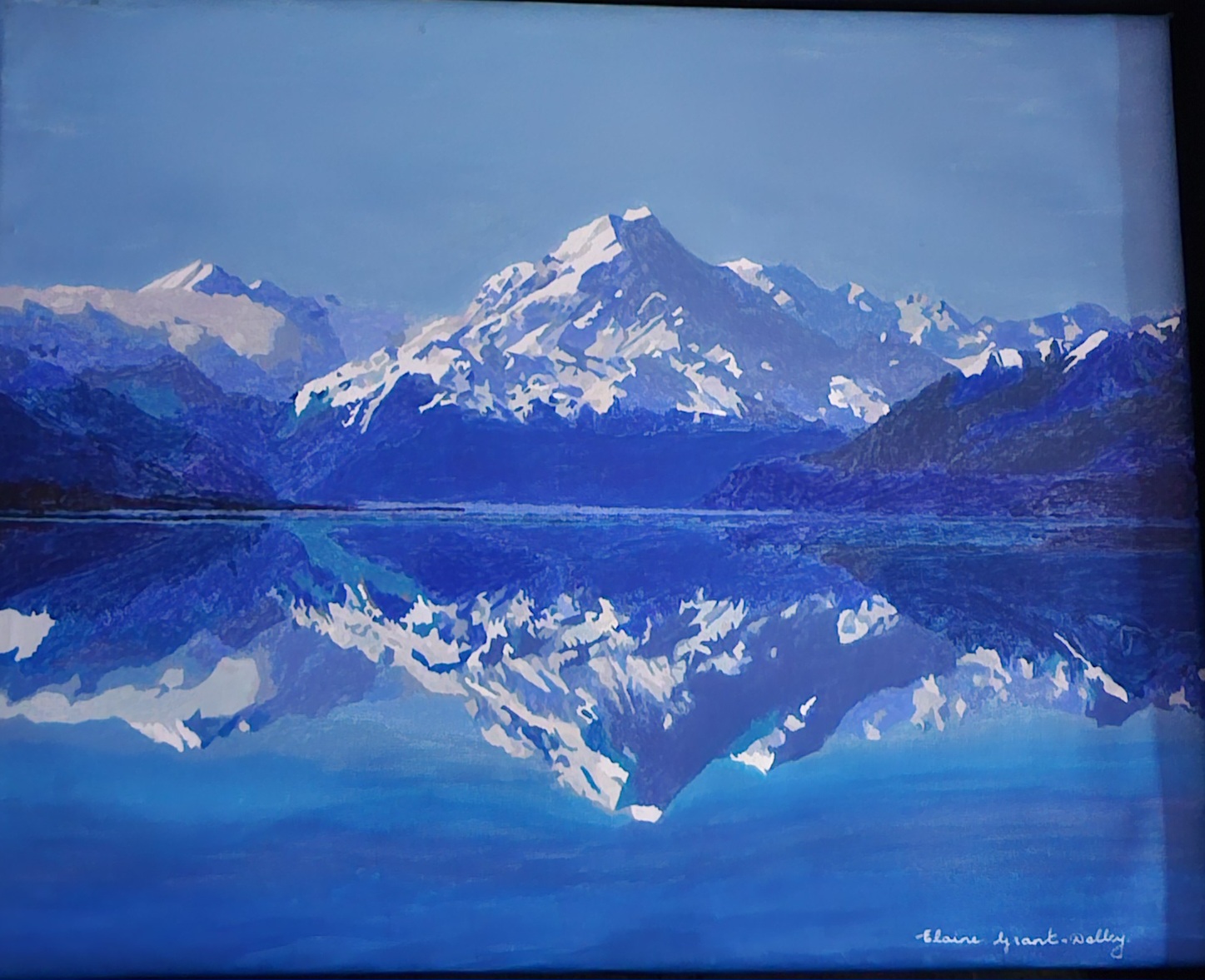 Elaine Grant-Dolby by Elaine Grant-Dolby, snow-capped mountain with deep blue sky reflection