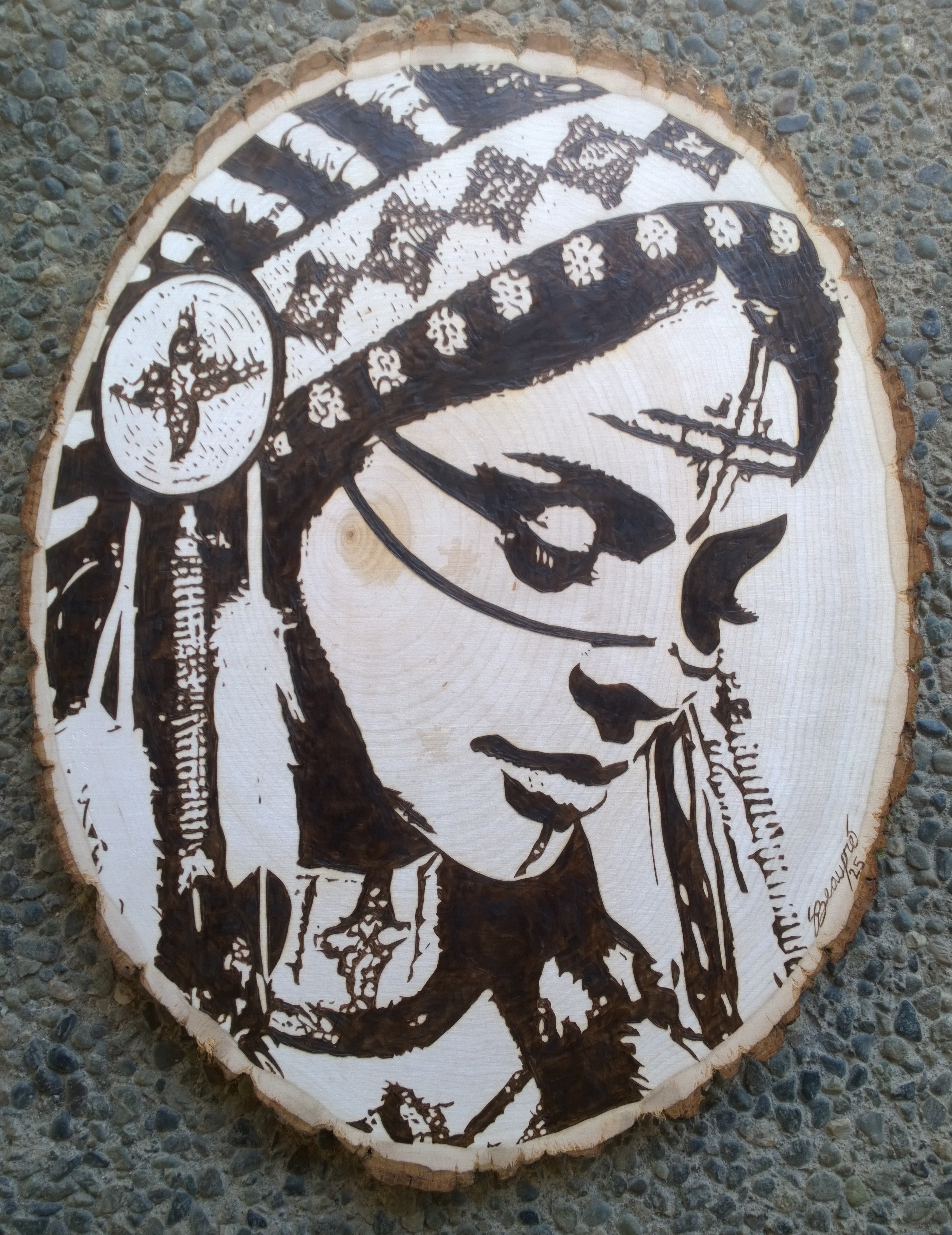 Thoughtful by Scott Beaupre, a detailed portrait on circular wood with a traditional headdress
