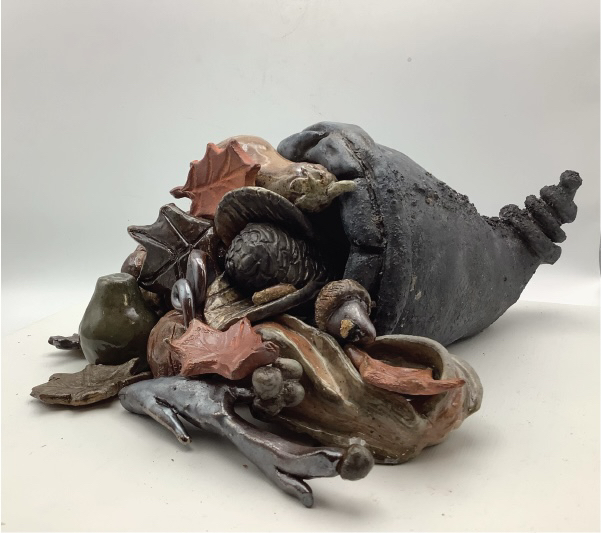 A Feast For a Beast by Aurora Ulrich, clay sculpture with natural elements