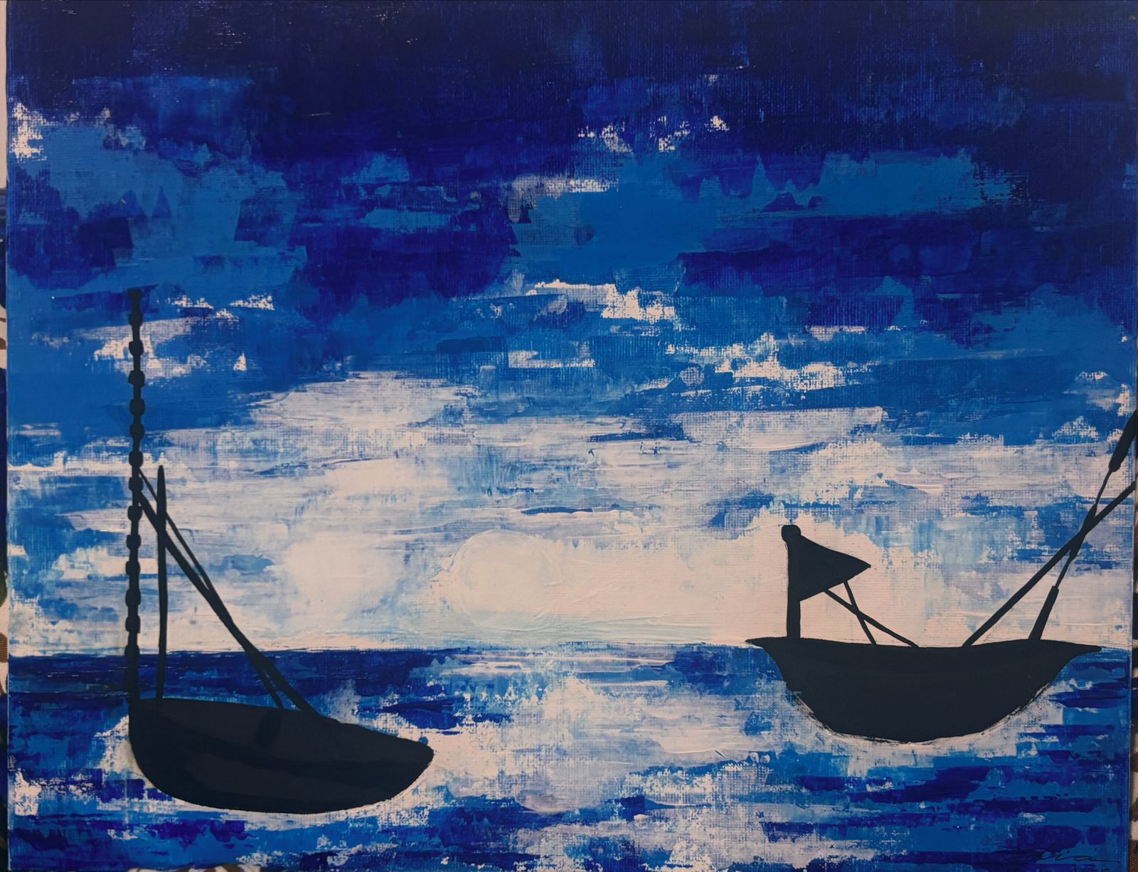 A view at dusk by Dia Rajmohan, featuring silhouetted boats on water