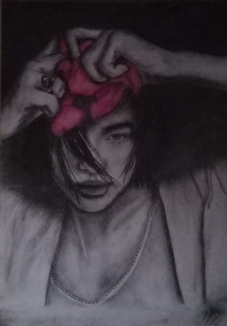 sketching by I.D.S.N.Ranasinghe featuring a young man with red flower petals