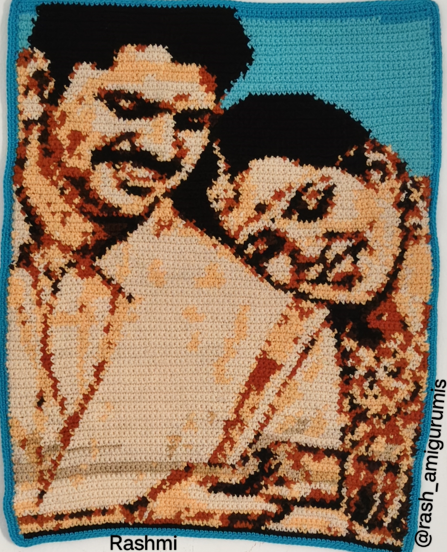 Crochet Portrait by Rashmi Arumugakannan, a tapestry with two closely positioned figures against a blue background