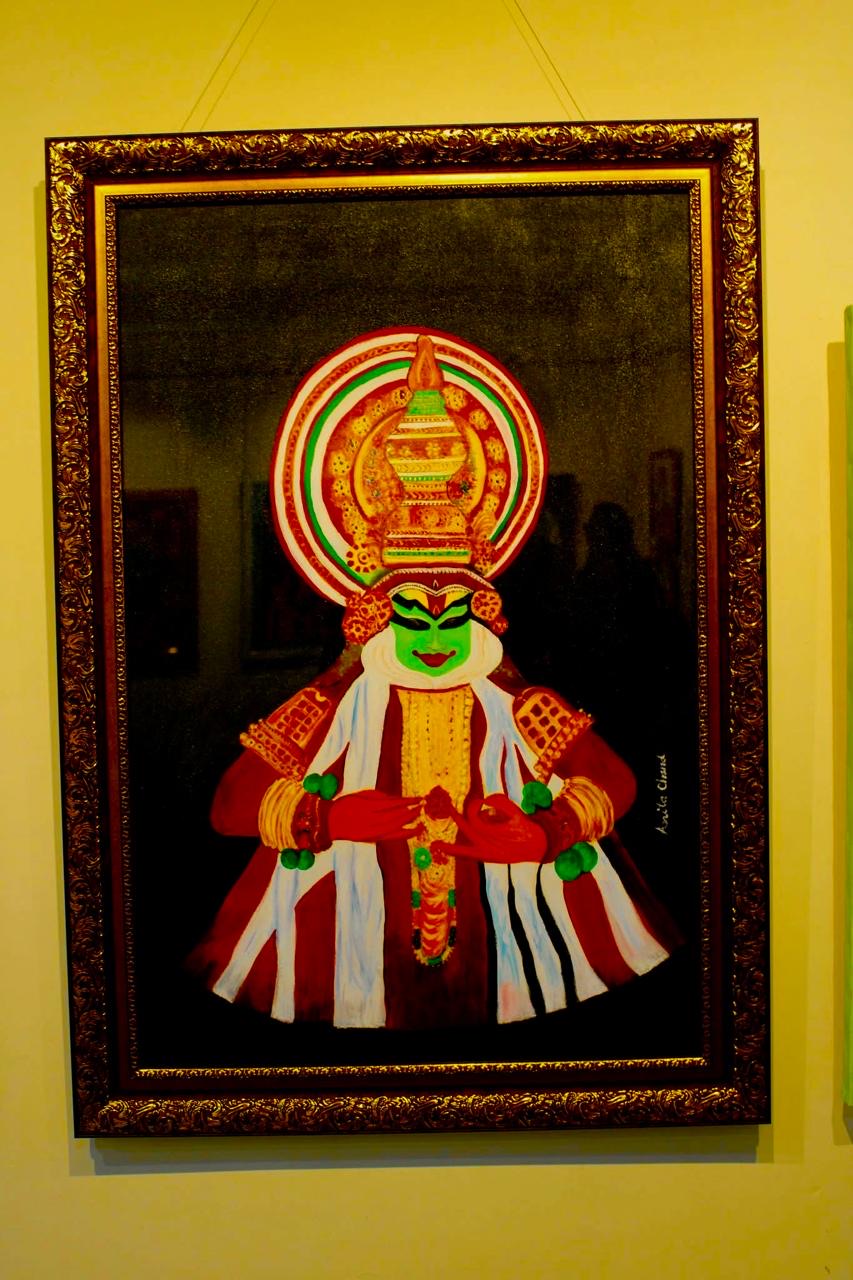 Kathakali (Pacha) by Anita Chand, featuring vibrant green face paint and ornate headgear