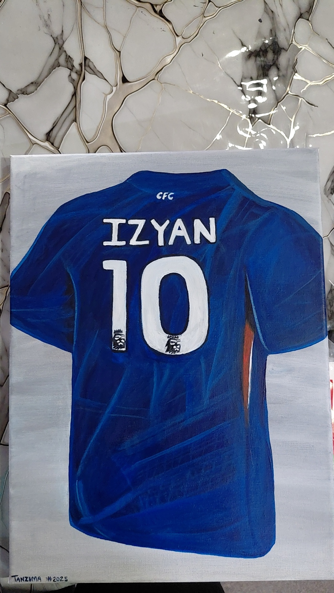 My Little Champion by TANZIMA BANO depicts a blue soccer jersey with "IZYAN" and number "10"