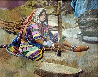 The banjara woman of Andhra by Sumitra Y Putty, vibrant traditional attire, pestle and mortar