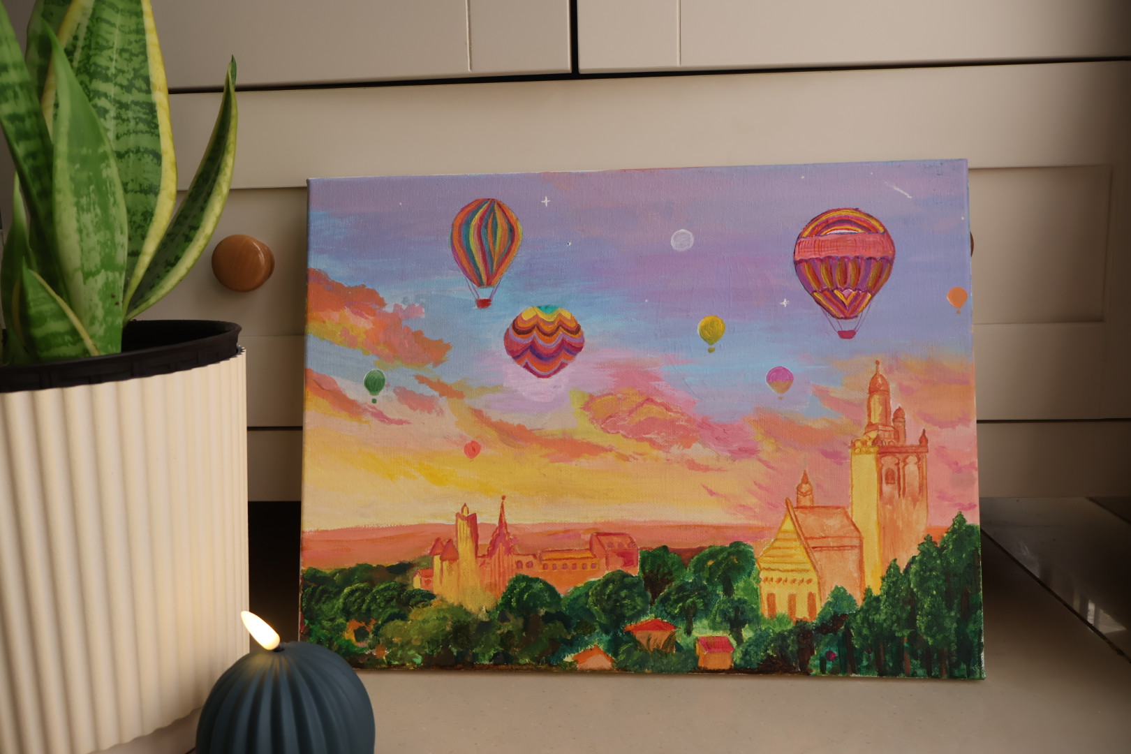 Hot Air Baloons flying at a beautiful scenary by Zeeka Khan, depicting vibrant hot air balloons against a sunset backdrop