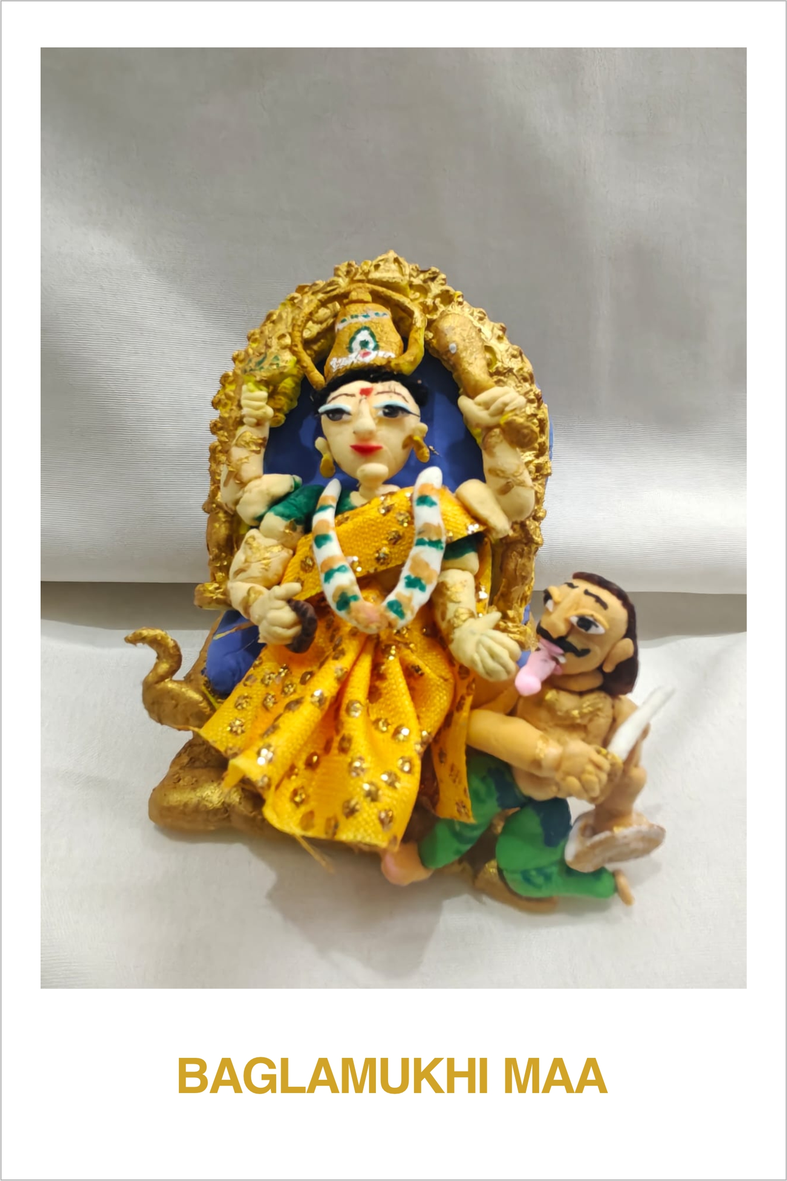 Calymodels of God and Goddess by Veer Sapru, detailed clay deity with golden headdress
