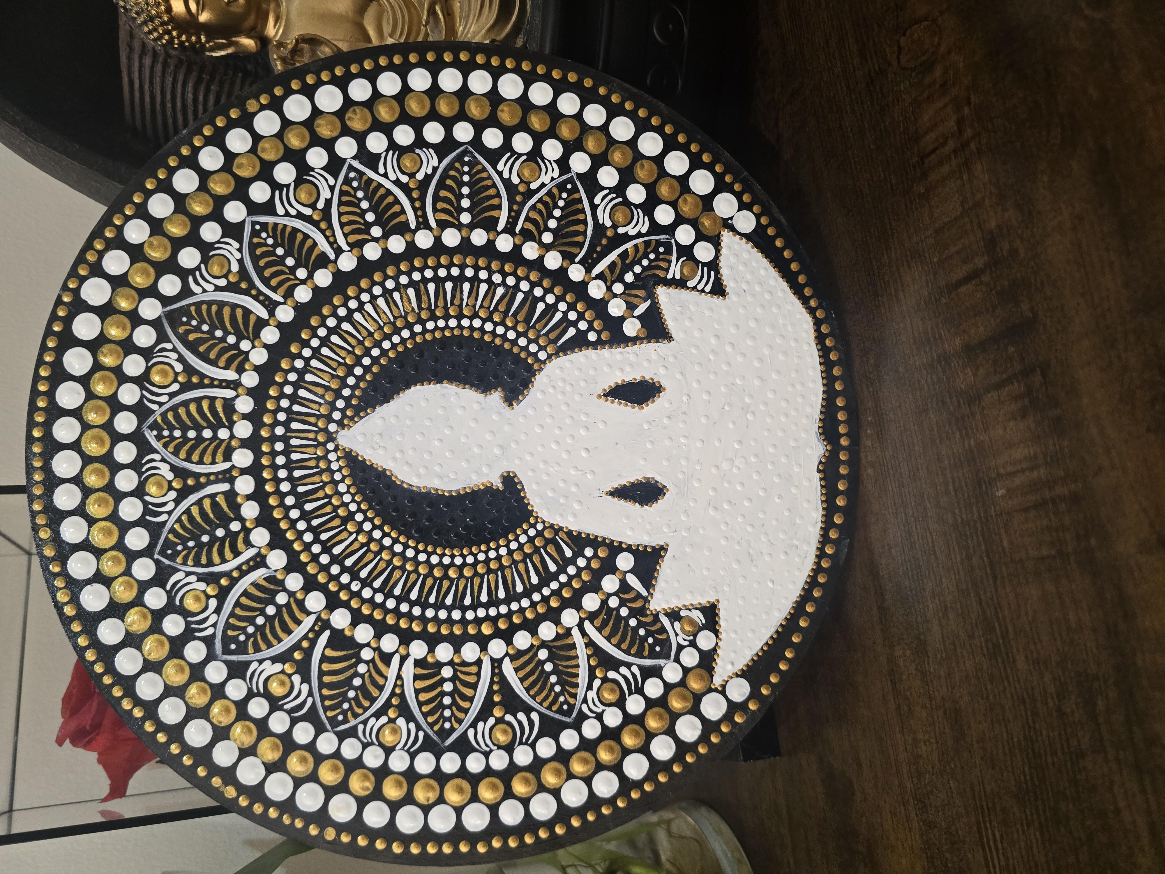Dot mandala art by Sandhya Mithun, featuring a meditative figure in a lotus position surrounded by intricate dot patterns