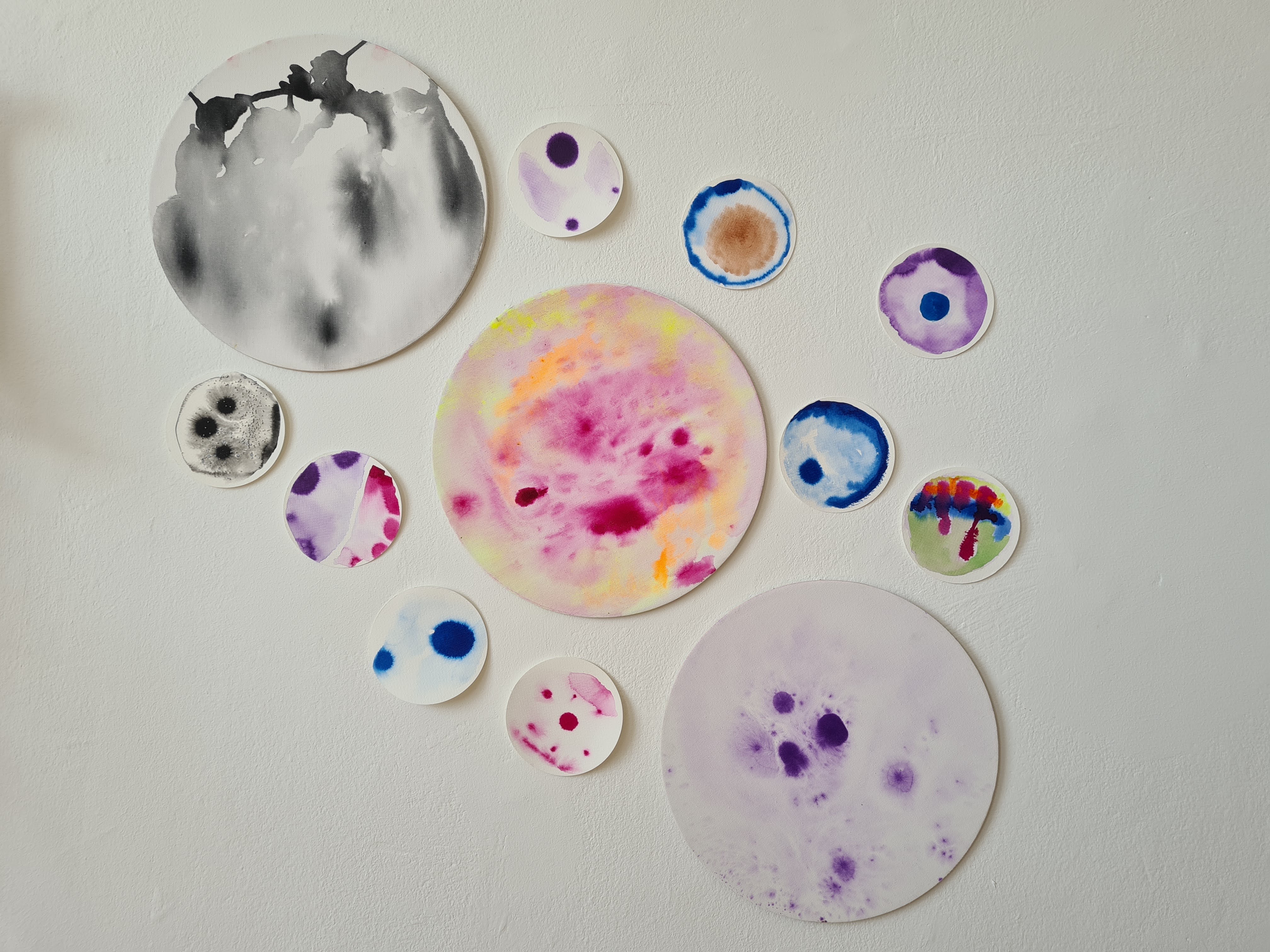 Fragments of escape by Karla britz, circular forms with ink patterns on handmade paper