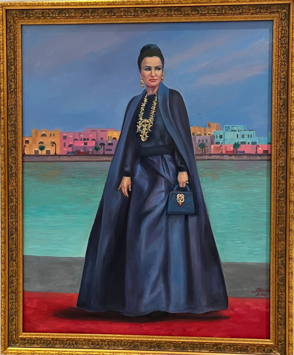 Her highness by Ola Ghassani, woman in dark gown on red carpet