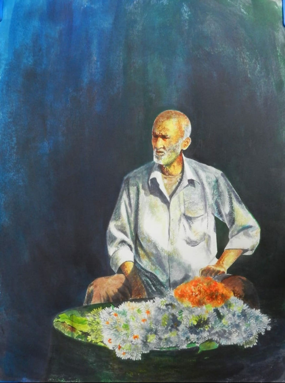 I see devotion in how patiently the flower seller waits keeping his delicate offerings fresh.