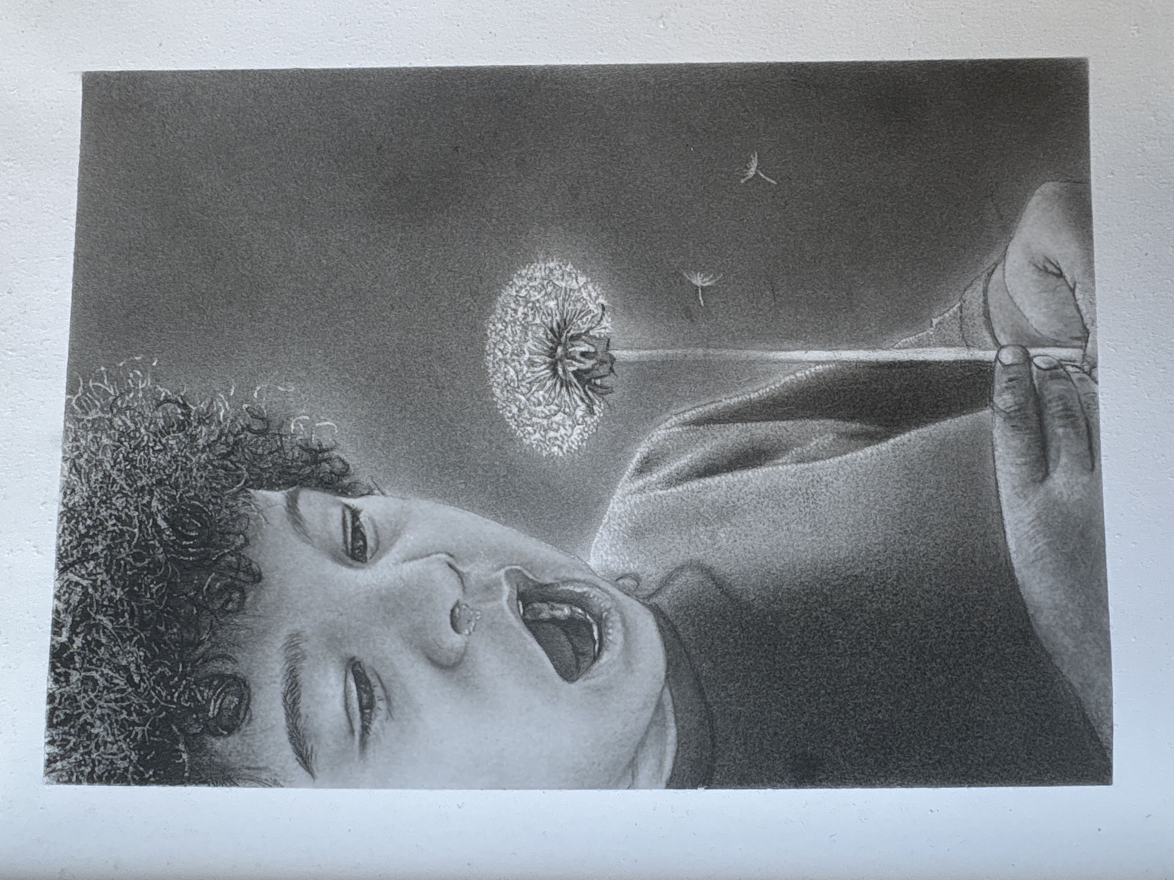 A child's joy by Nathanael Morris-Mckenzie, child blowing dandelion seeds