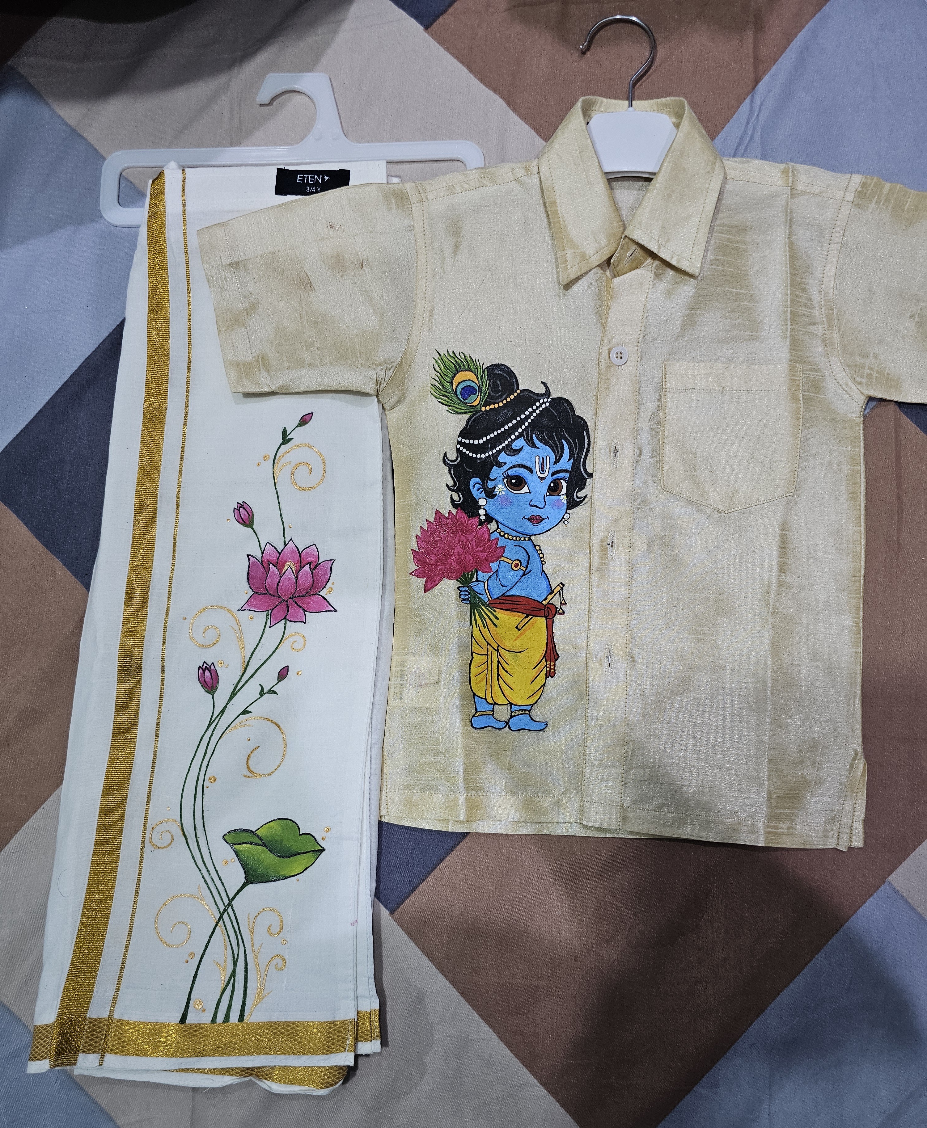 Divine Grace: The Little Krishna by Ansika Ansu, traditional child-sized garment with artistic depiction