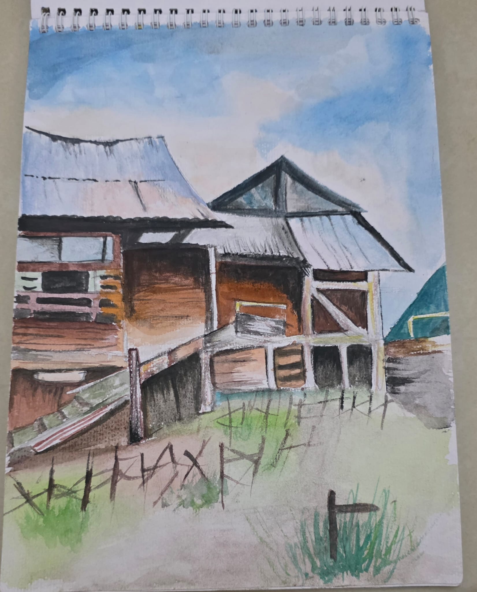 Watercolor of a Malaysian wooden stilt house by Mishri Maheshkumar Patel - elevated structure with sloping roofs