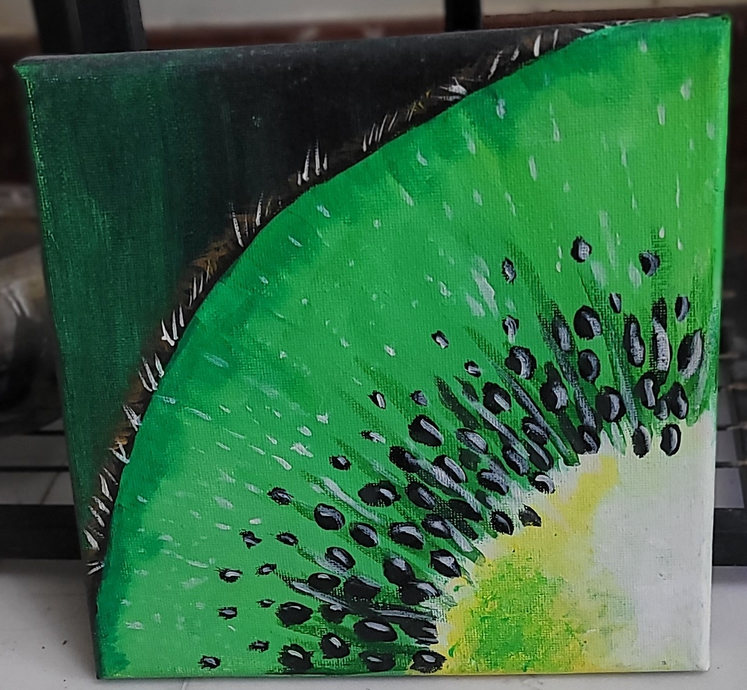 Kiwi by Chryslyn Giselle Pacheco, close-up of a vibrant green kiwi slice