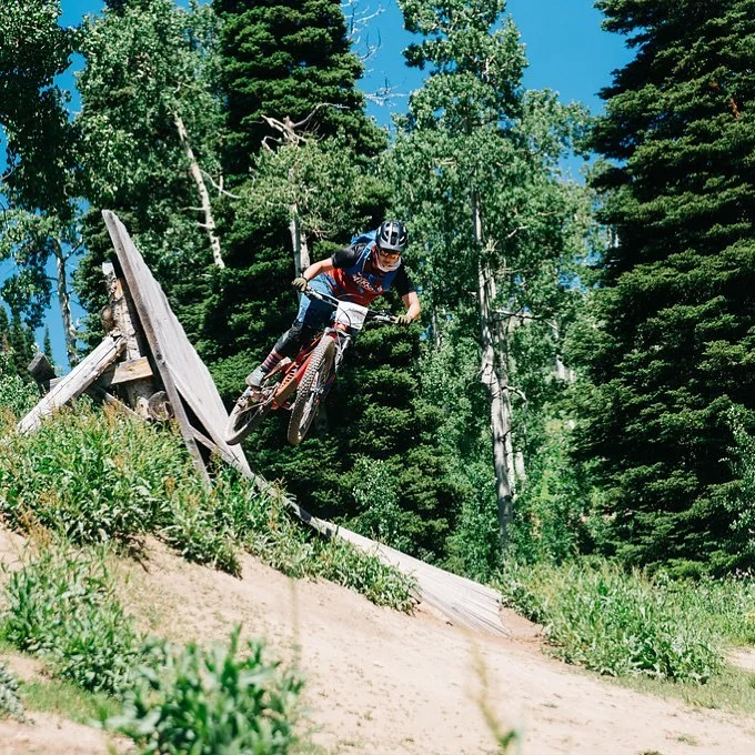 Cierra jumping her mountain bike off a wall ride in Wyoming