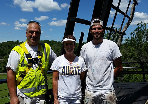 current picture of Muscat Painting owners, Brett and Regina Muscat with their son, Trent