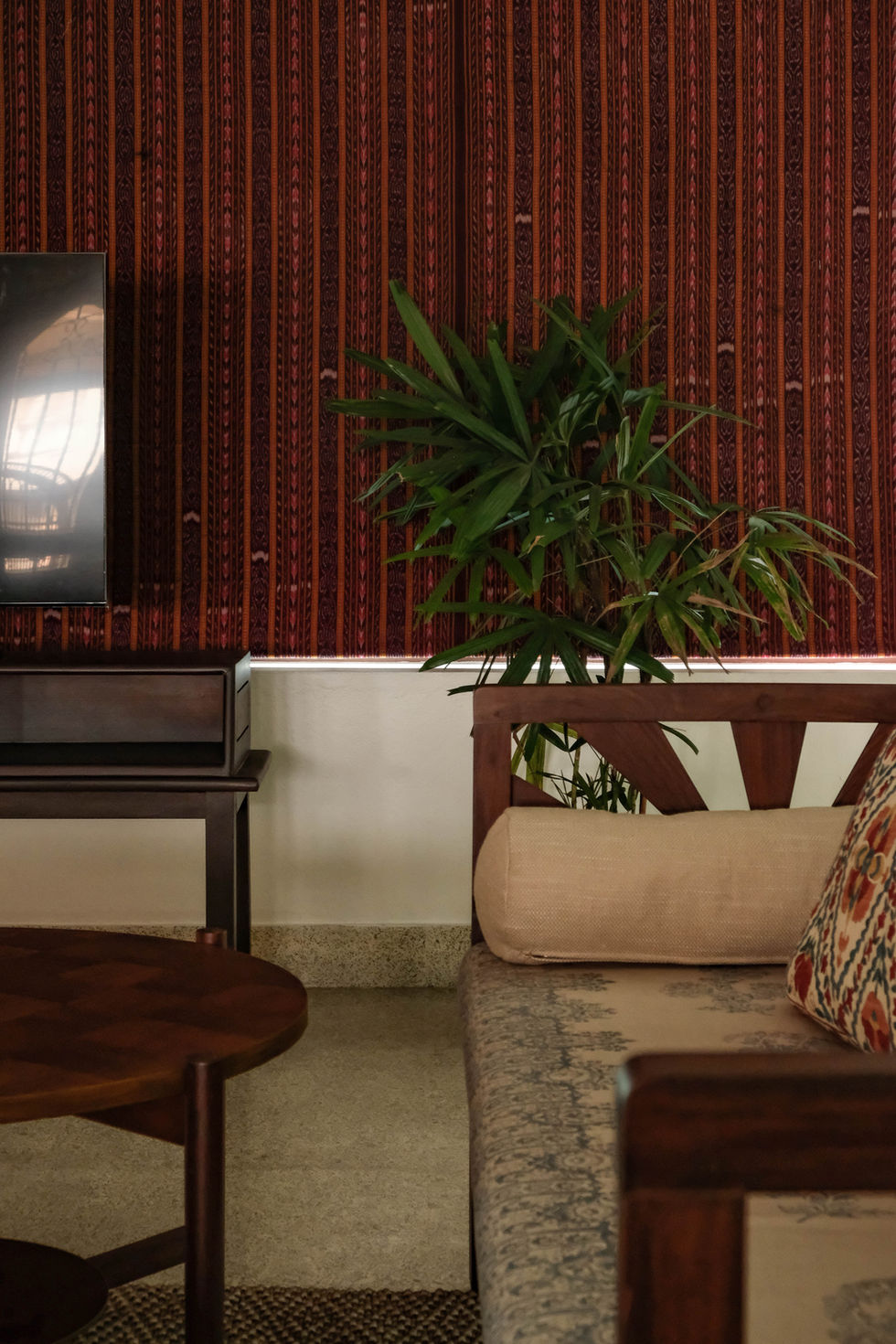 a living room with a couch a table and a tv