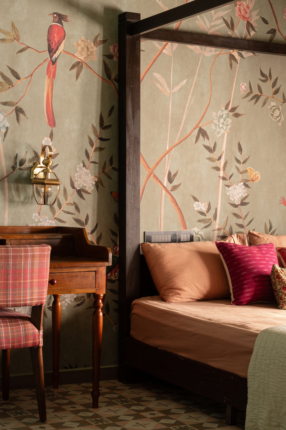 a bedroom with a canopy bed and a desk