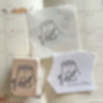 Illustration of a cat making Matcha on a rubber stamp with wooden handle