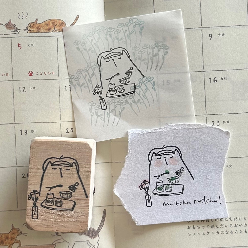 Thumbnail: Illustration of a cat making Matcha on a rubber stamp with wooden handle