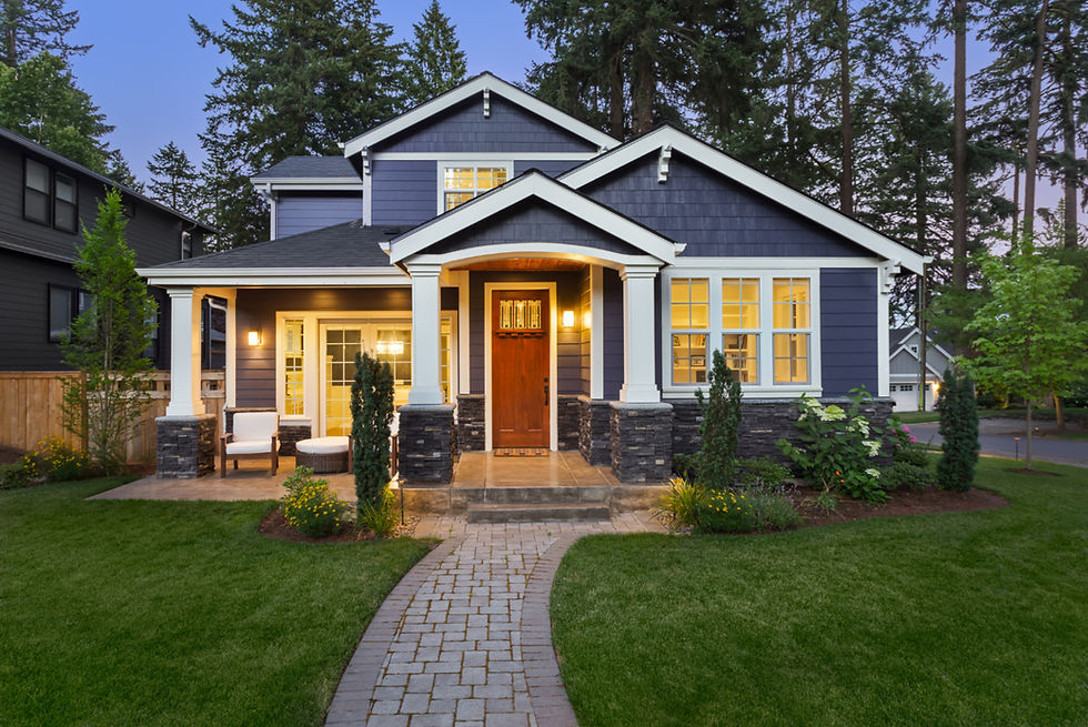 exterior of blue house with beautiful front door and landscaping