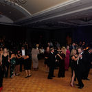 Packed dance floor at a Houston event venue featuring entertainment by Grupo KaChe, bringing guests together through live Latin and variety music.