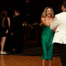 Couple dancing and enjoying a formal celebration at a Houston event venue while Grupo KaChe provides high-energy live entertainment.
