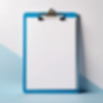 clipboard and one paper clip white and blue standing vertically.jpg