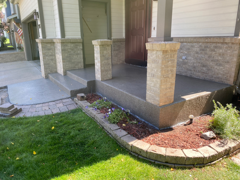 Flake-coated entry steps and walkway with landscaping