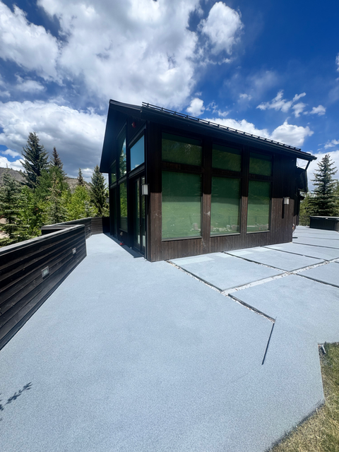 Coated front porch steps and walkway at a residential entry