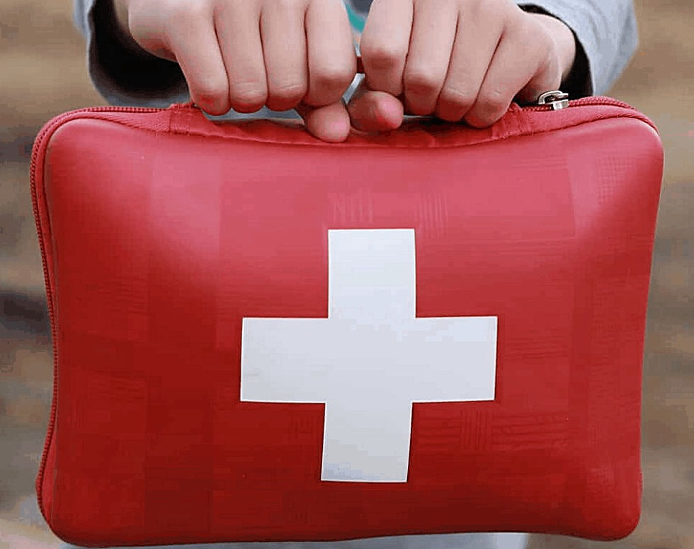 child holding first aid box